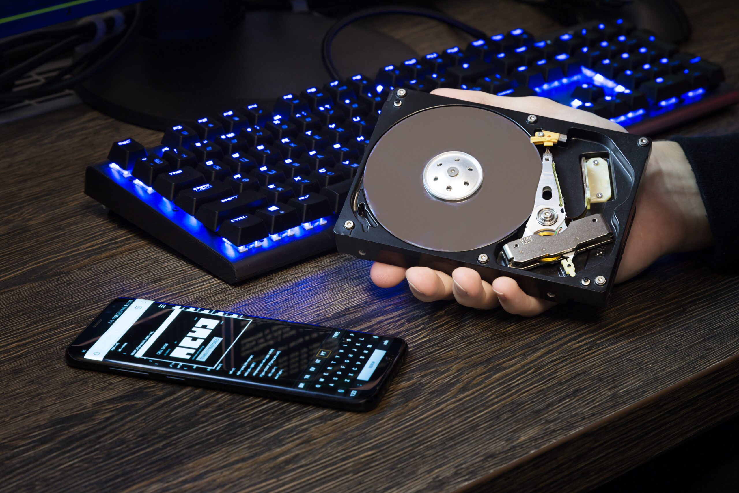 hdd disk in a man s hand against the background of 2023 11 27 05 23 44 utc scaled